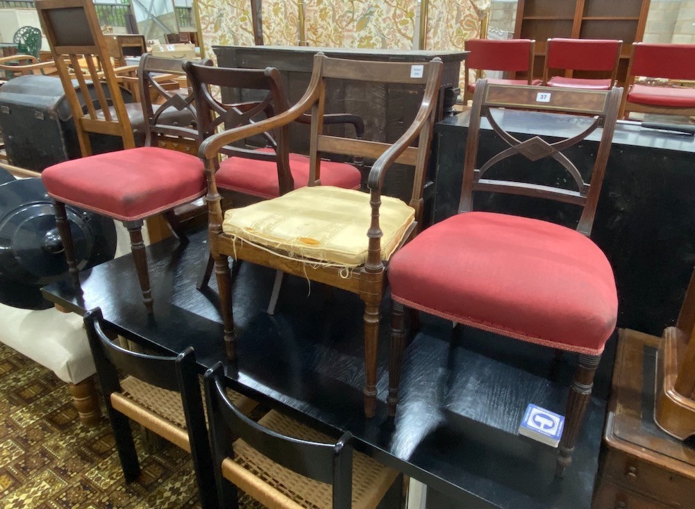 Four Regency brass inlaid mahogany dining chairs one with arms, together with a Regency caned seat elbow chair.